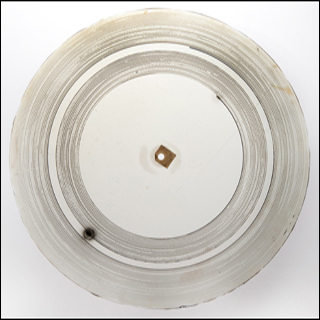 A photograph of a "glass disc," an early type of audio recording, made in the 1880s.