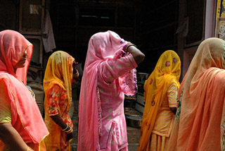 Women in brightly colored saris.
