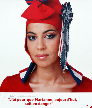 A Muslim woman dressed as Marianne wearing a phrygian cap. Text below reads 'I'm afraid Marianne today is in danger'.