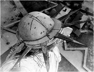 Aerial view of the Statue of Liberty in New York, the angle from the above her head accentuating the shape of the iconic headress.