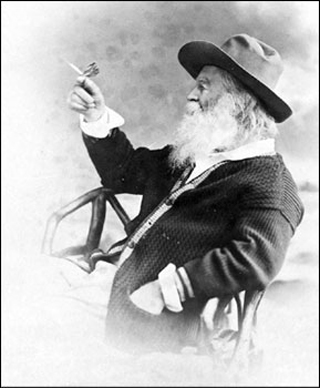 Photo of Walt Whitman holding butterfly.