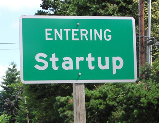 Photo of town sign that reads: "Entering Startup."